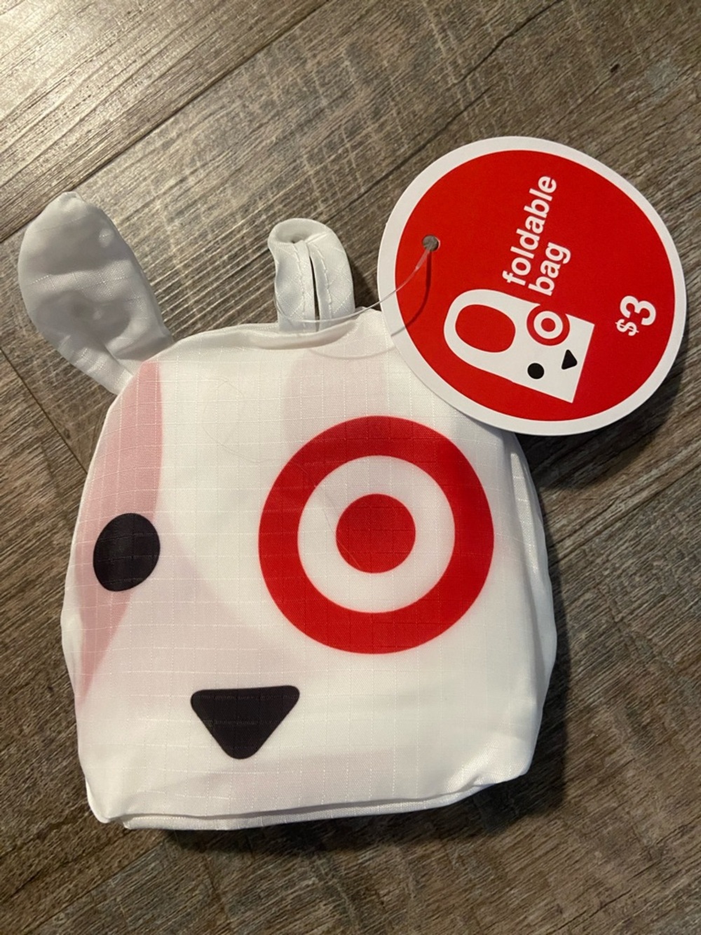 Target Dog Foldable Tote Bag - White, Red, Black and a green stuff dinosaur